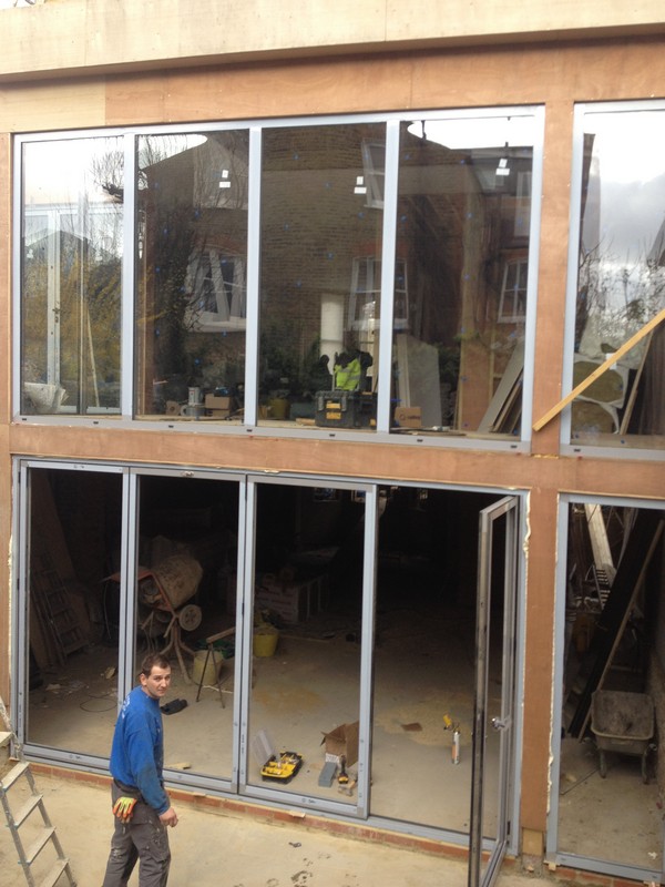 Aluminium bi-fold doors with two-storey glazing in Reading
