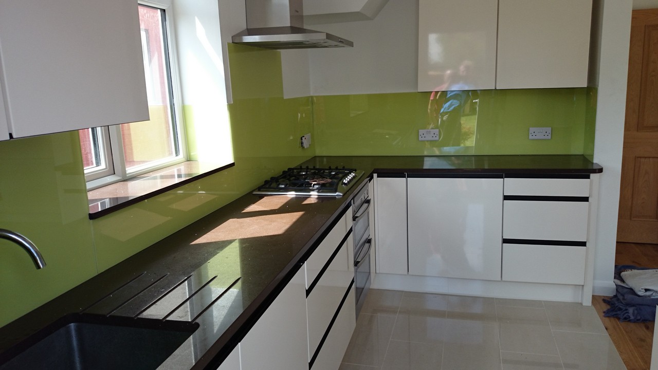 Lime green glass kitchen splashback installed by Reading glaziers
