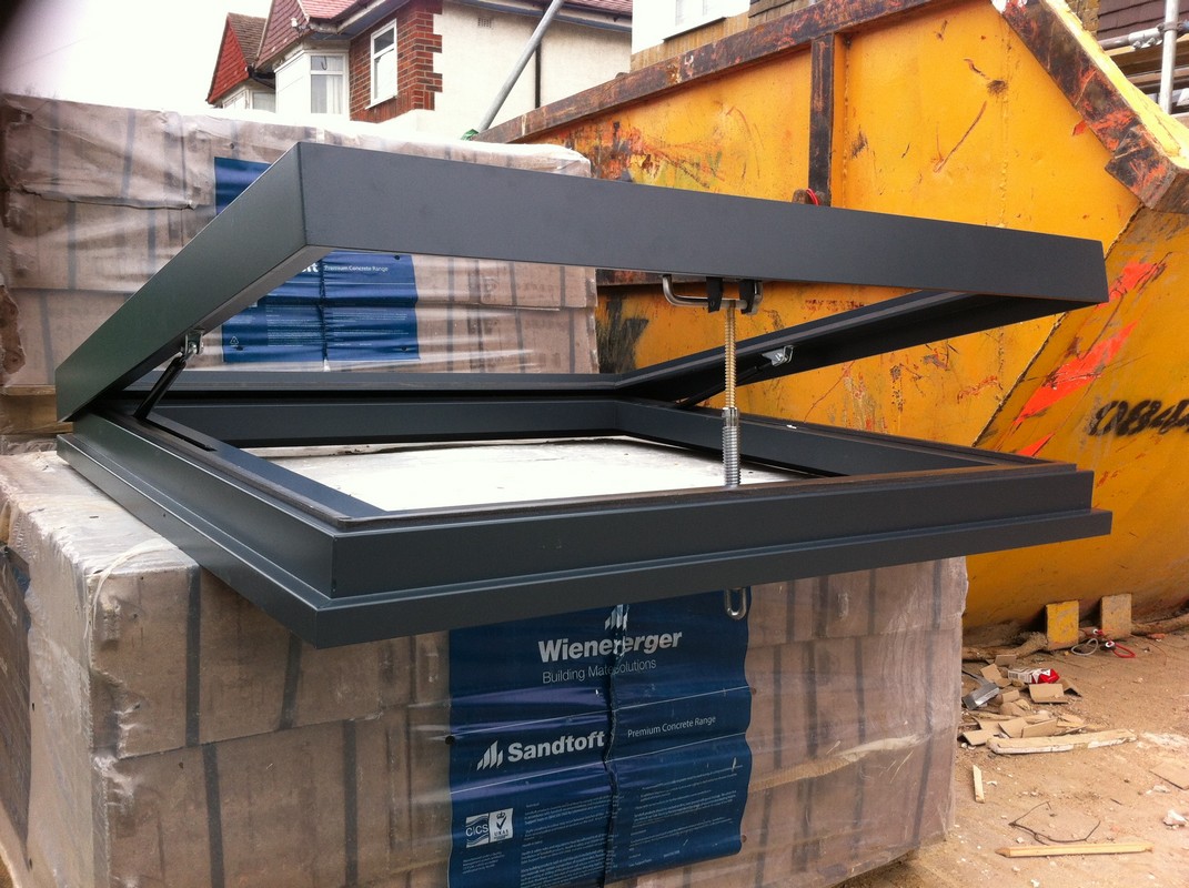 Opening flat roof skylight in anthracite grey installed in Reading
